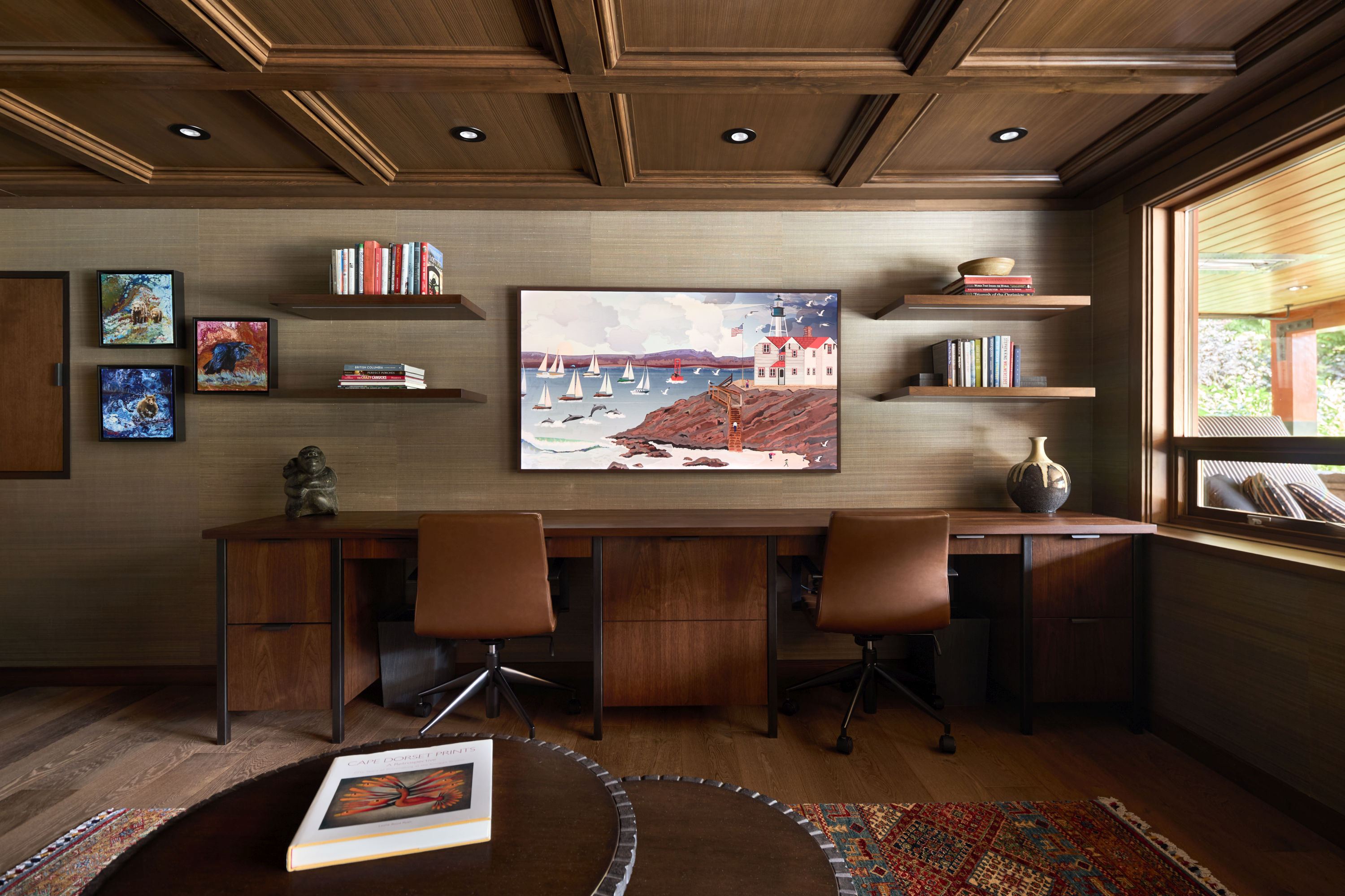 Walnut coffered ceiling, custom floating shelves, and custom desk